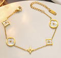 Gold O-chain bracelet with clover charms
