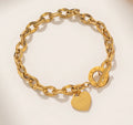 Gold O-chain bracelet with heart charm