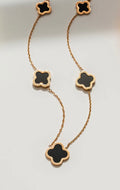 Gold necklace with green shell clover charms