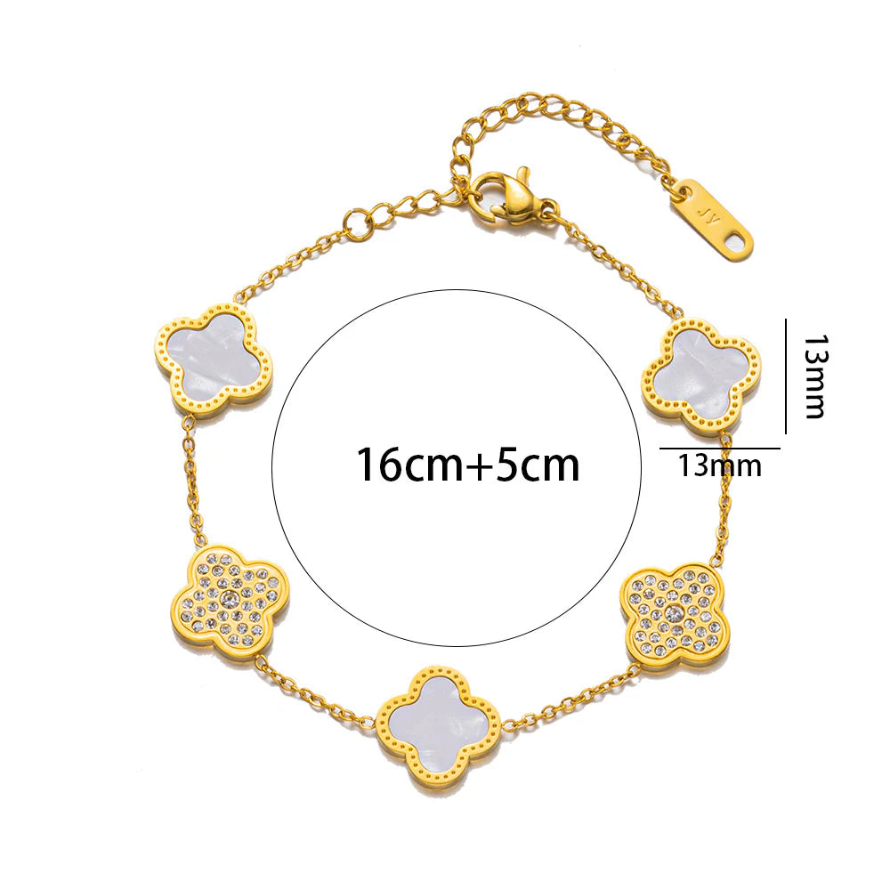 Gold bracelet with rhinestone four-leaf clover charms